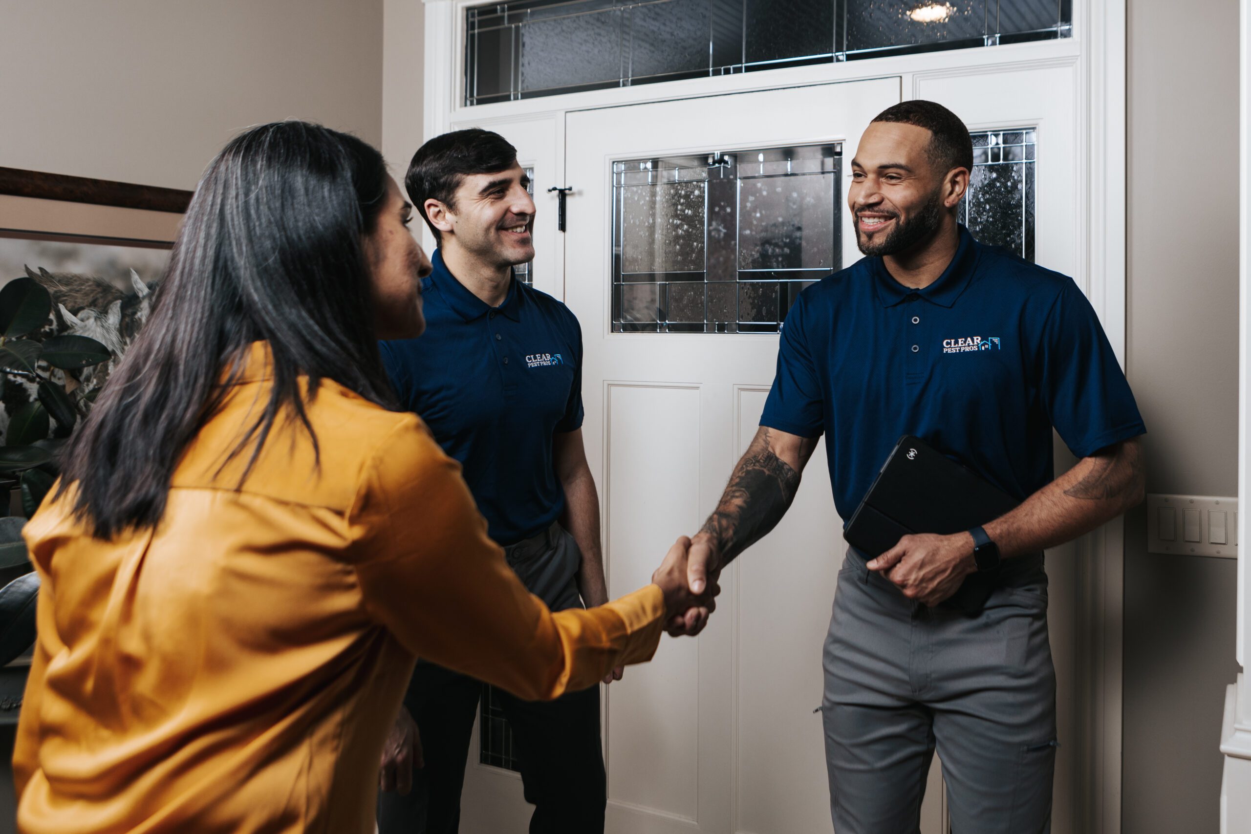 Clear Pest Pros franchise Employees shaking hands with a client