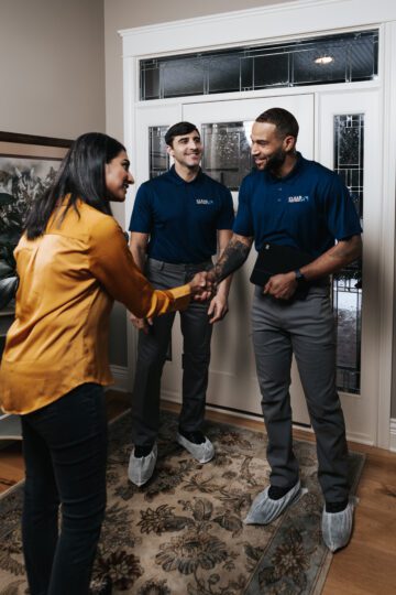 Clear Pest Pros Employees shaking hands with a client in home